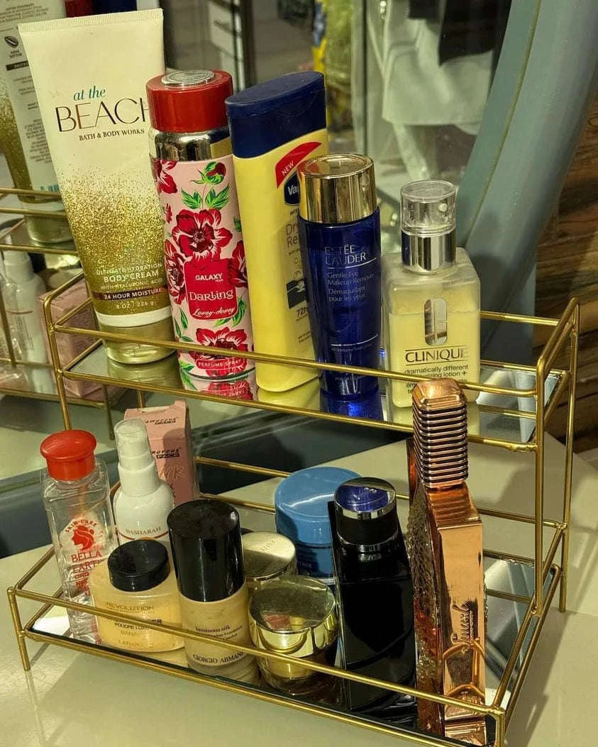 Elegant double-layer gold organizer with mirror - perfect for storing makeup, jewelry, and skincare while adding a luxurious touch to your vanity.